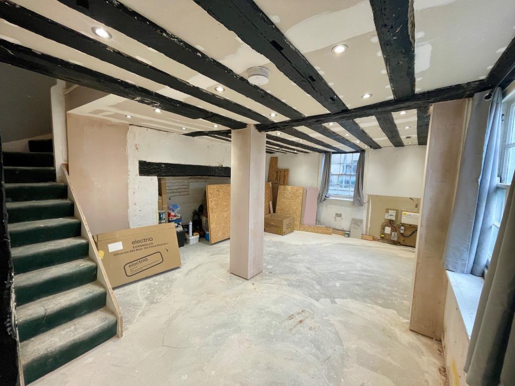 Lot: 136 - COTTAGE WITH IMPROVEMENT WORKS REQUIRING FINISHING - Living room with fireplace